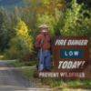 Fire danger level sign example - Smokey Bear with a low fire danger level on roadside